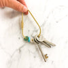 Crystal Donut keyring with green aventurine, turquoise and rose quartz