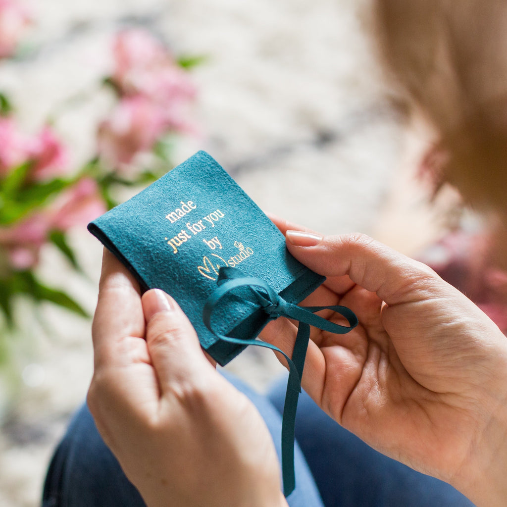MW Studio gift pouch in hands