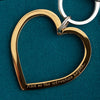 close up of personalised engraving on gold heart keyring